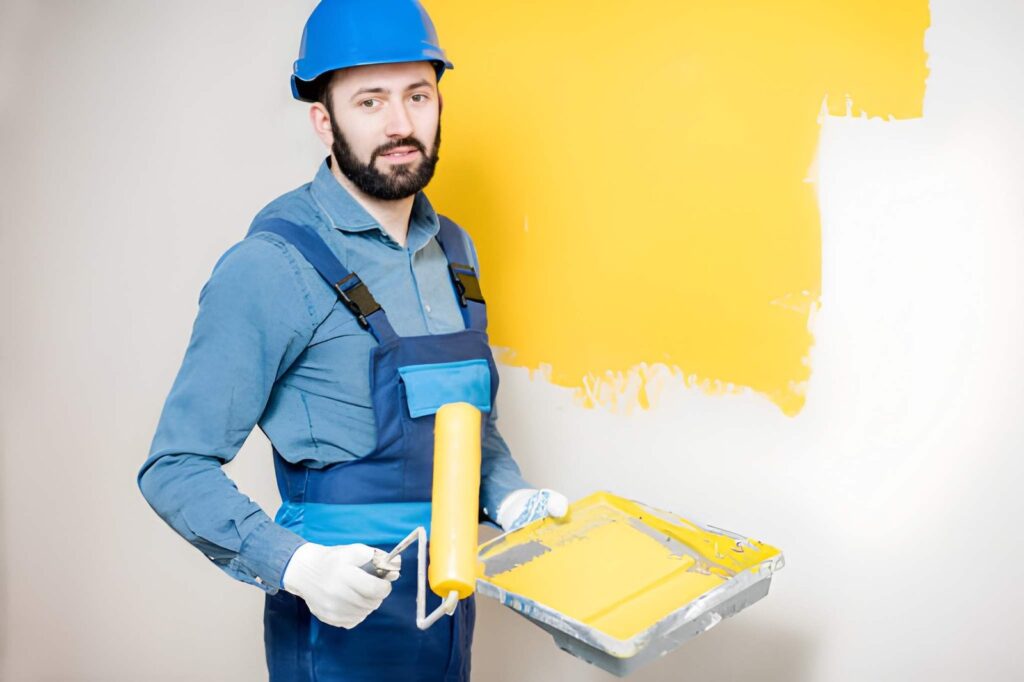 Painter Painting a wall